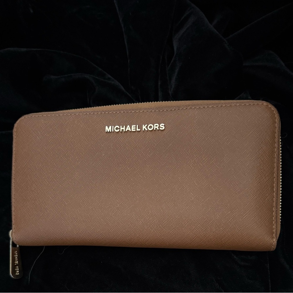 Michael Kors Jet Set Travel wallet. wallet is awesome, unzips flat easy access.